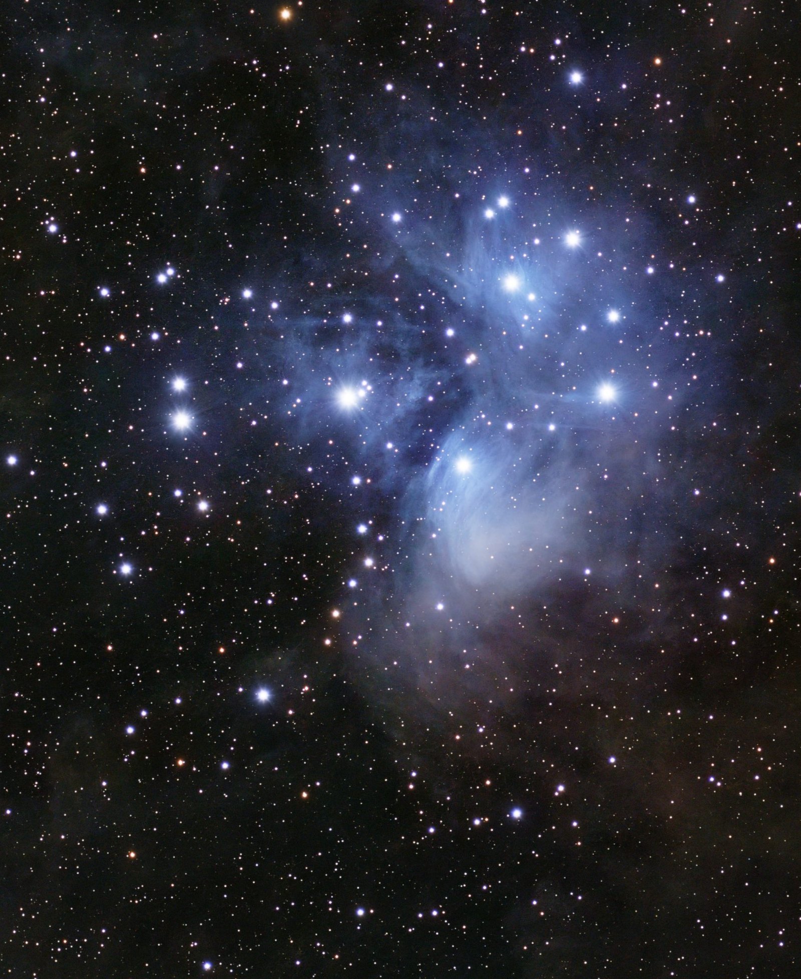 The Pleiades processed: blue reflection nebula streaming around the stars