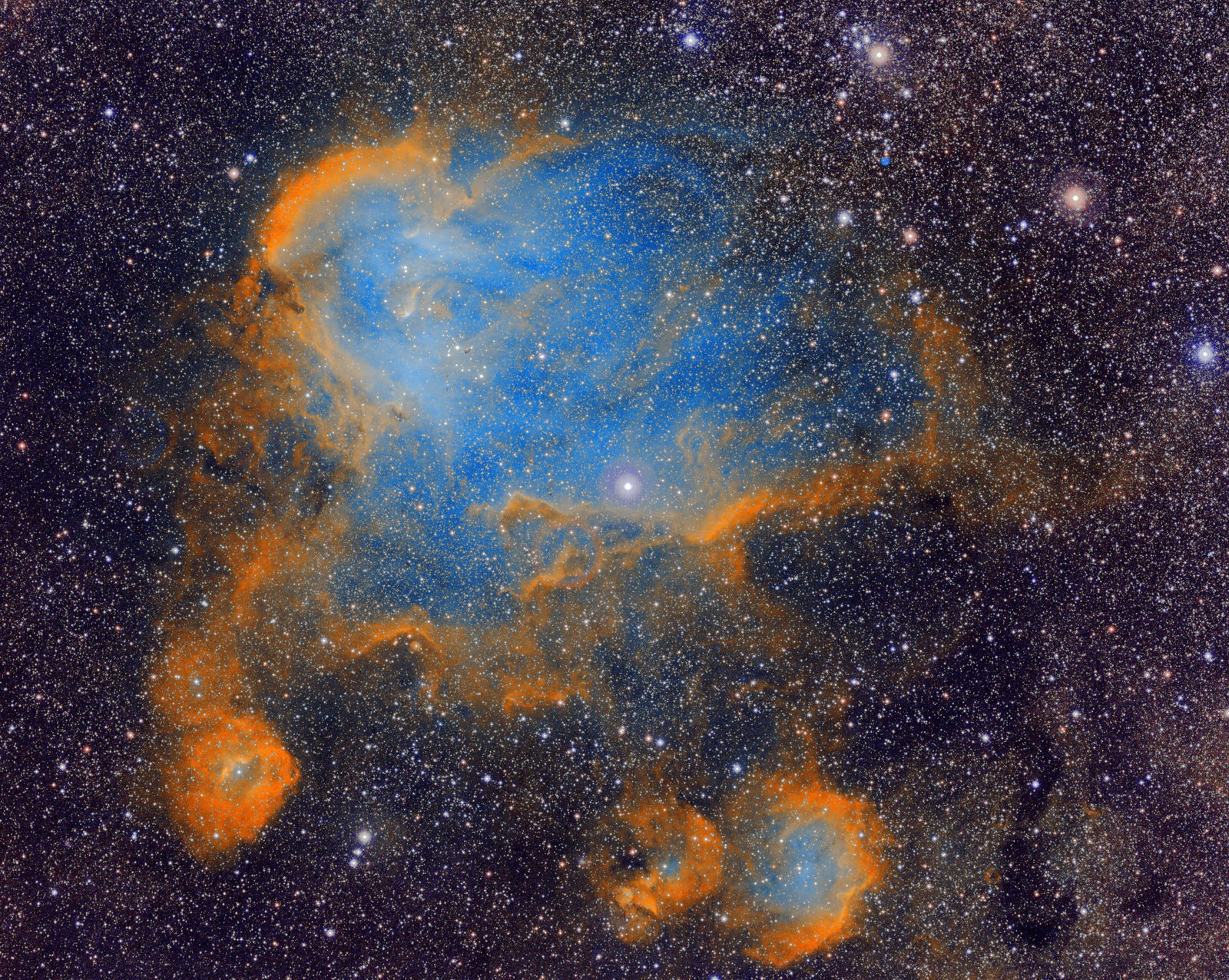 IC 2944 in the Hubble palette: orange shells around a blue cavity